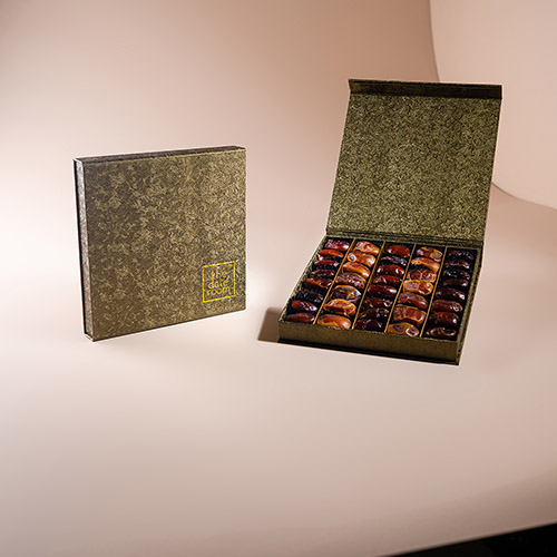 A luxurious box of The Date Room's Kholas Dates, representing the finest Emirati date varieties and the company's commitment to preserving Emirati date culture.